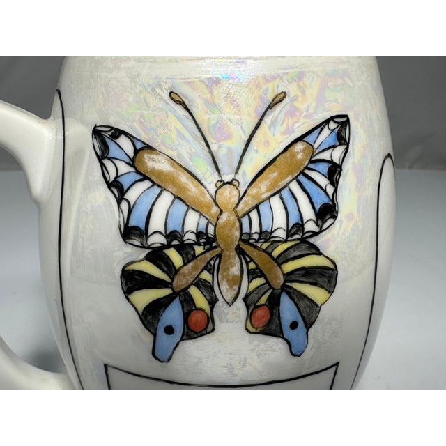 Art Nouveau Bavarian Hand Painted Butterfly Mug for your consideration. The mug measures approx. 5 3/4 inches tall and...