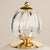 This sophisticated table lamp combines a minimalist, organically inspired silhouette with details reminiscent of fine...