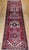 "This striking vintage Persian Heriz runner, woven in the second quarter of the 20th century, features a classic geometric...