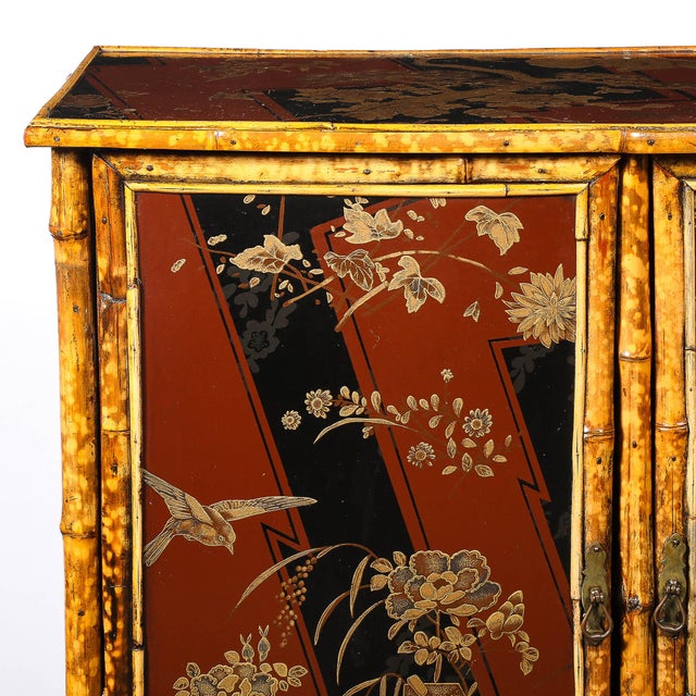 This Art Deco gilt Chinoiserie cabinet, crafted in China circa 1925, is a masterful blend of tradition and modernity,...