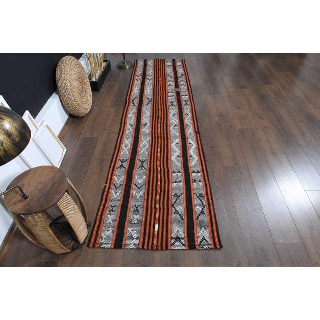 Vintage Hand-Knotted runner rug is a semi-antique vintage runner rug. The '70s Eastern region of Anatolia's unique rug is...