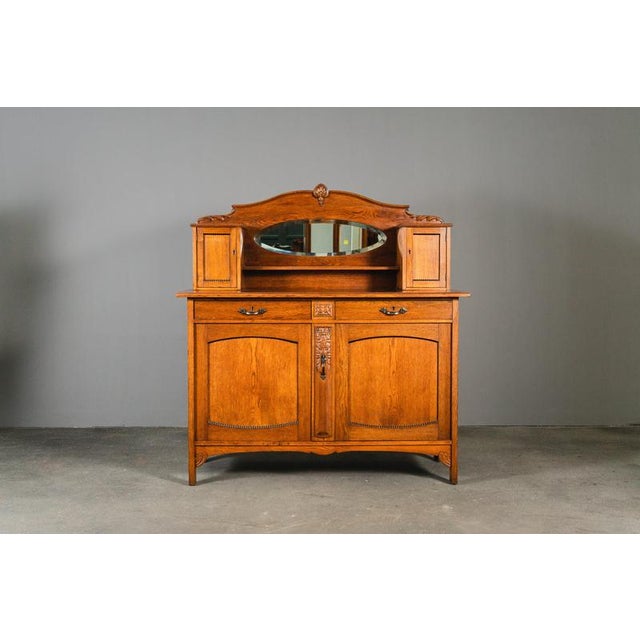 Item: Sideboard Period & Style: Art Nouveau - Early 20th Century Features: - Elegant and practical piece of furniture with...