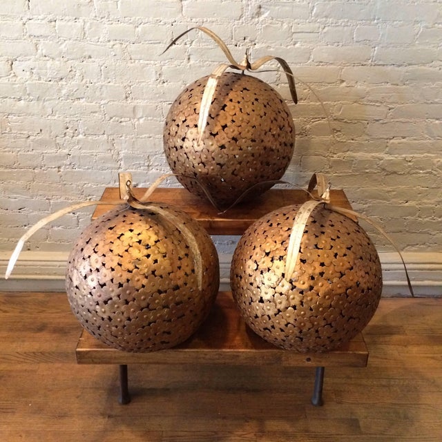 This set of 3 large, impressive painted steel decorative ball ornaments is from a Macy’s Department store display, circa...