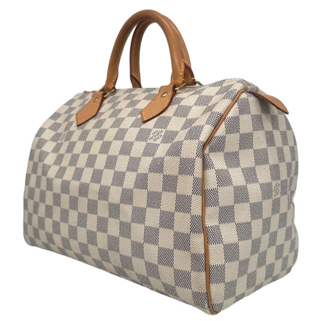 Louis Vuitton Damier Azur Speedy 30 Top Handle Bag, France 2010. This iconic speedy was first introduced in the 1930's and...