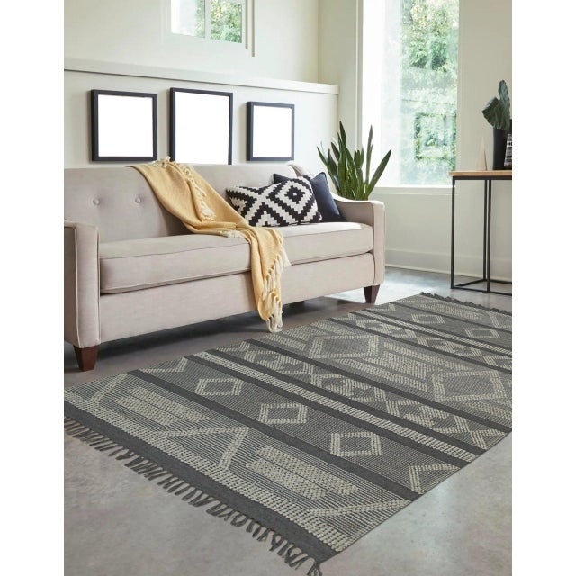 Vibrant Iris Gray Handmade Rug, Country of Origin: India. This striking piece offers a sophisticated interpretation of...