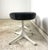 Pedestal Stools by George Nelson; Vitra. Original condition with newly upholstered seats in gray shearling. Enameled...
