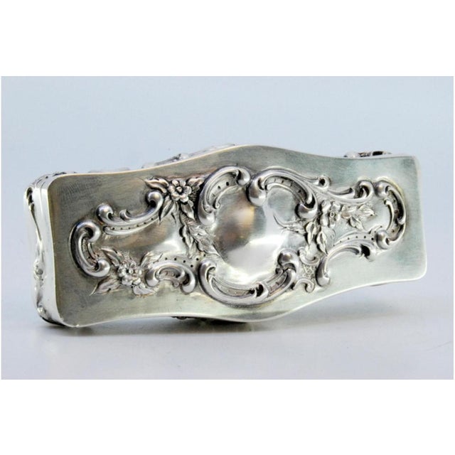 Box in Embossed Silver with Floral Motifs and Scrolls, in Very Good conditions. Designed 1920 to 1949 This piece has an...