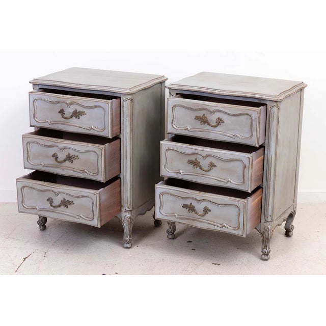 Pair Of Three Drawer French Provincial End Tables with gray distressed wax finish. Nice French Style brass hardware....