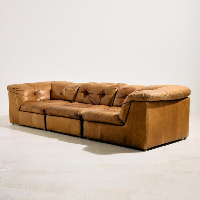 Three-seater modular leather sofa set from the 1970s. The set consists of two corner pieces and one single piece, covered...