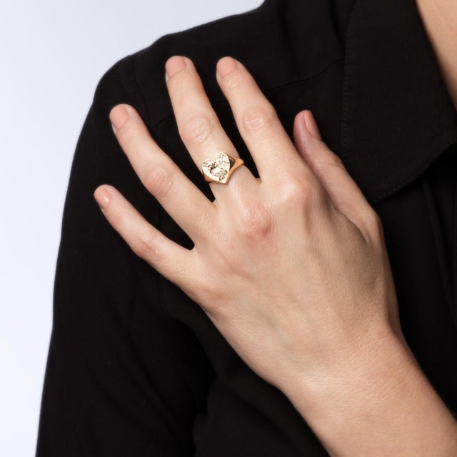 Stylish diamond owl ring crafted in 14 karat yellow gold. Diamonds total an estimated 0.09 carats (estimated at I-J color...