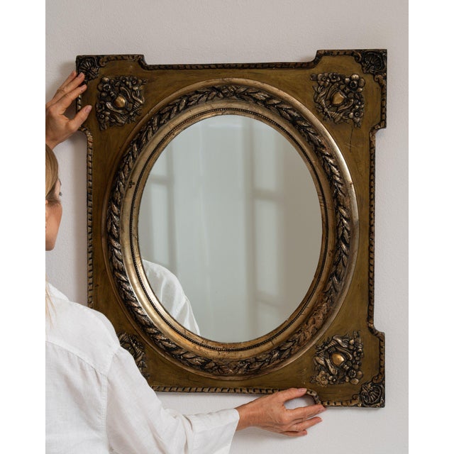 Repousse brass oval mirror in Antique Brass. Its antique brass finish sets off ornate floral repousse frame, aged brass...
