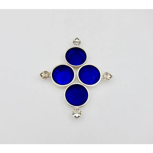 A vintage set of four open salt cellars from Georg Jensen of Denmark in the company's Acorn pattern. Each salt bears the...