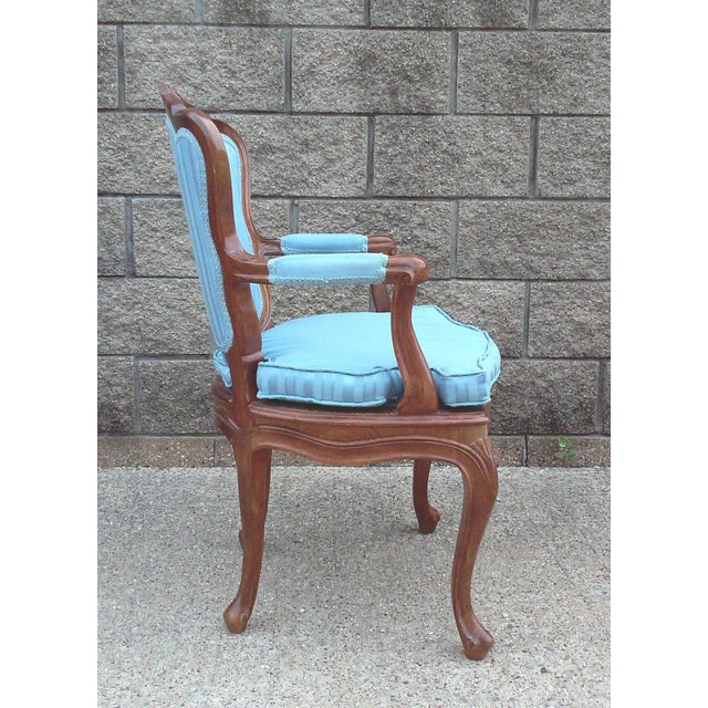 A vintage handmade arm chair in blue satin striped damask upholstery with gimp trim. This elegant side chair was hand made...