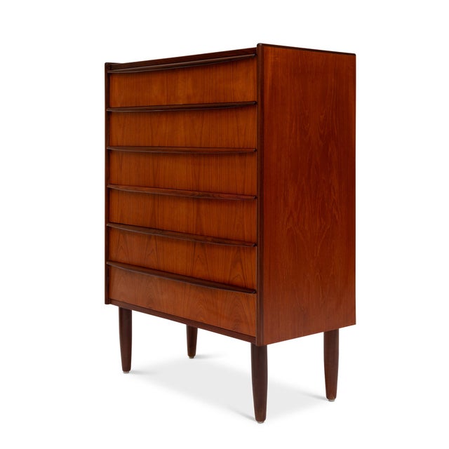 This stunning 1960s Danish Mid-Century teak tallboy dresser is a timeless piece of craftsmanship. Featuring exquisite wood...