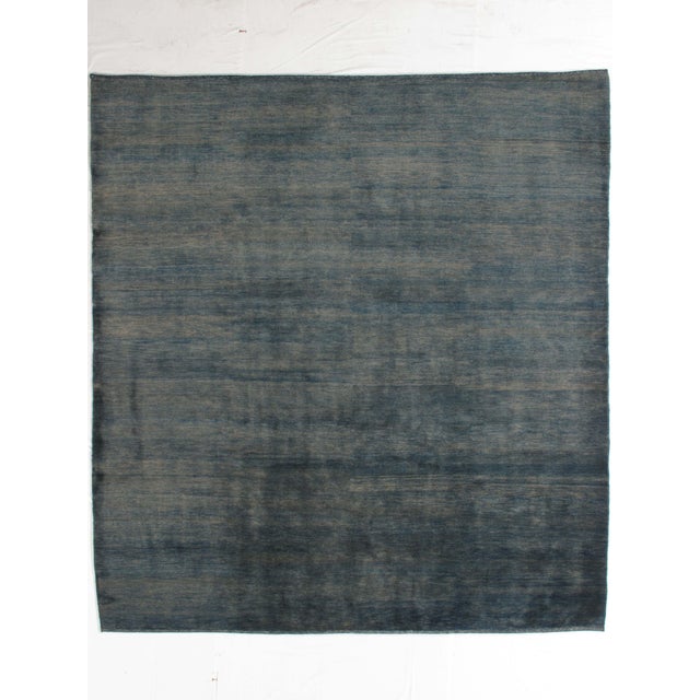 Vintage hand-knotted Persian Lori Gabbeh rug featuring a warm, minimalist field framed by a softly defined border with...