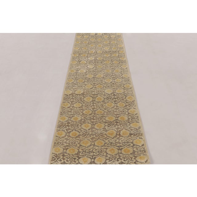 Made with a luxurious blend of hand-knotted wool, this 3x8 runner is a sophisticated addition to Rug & Kilim’s Block Print...