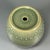 This vintage‑style rounded celadon jar adopts delicate crackled green glaze, decorated with rows of raised dot ornaments...