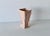 Vintage McCoy Art Deco Wing Vase from the 1940s, featuring a matte rose pink glaze, flared winged sides, and a square rim....