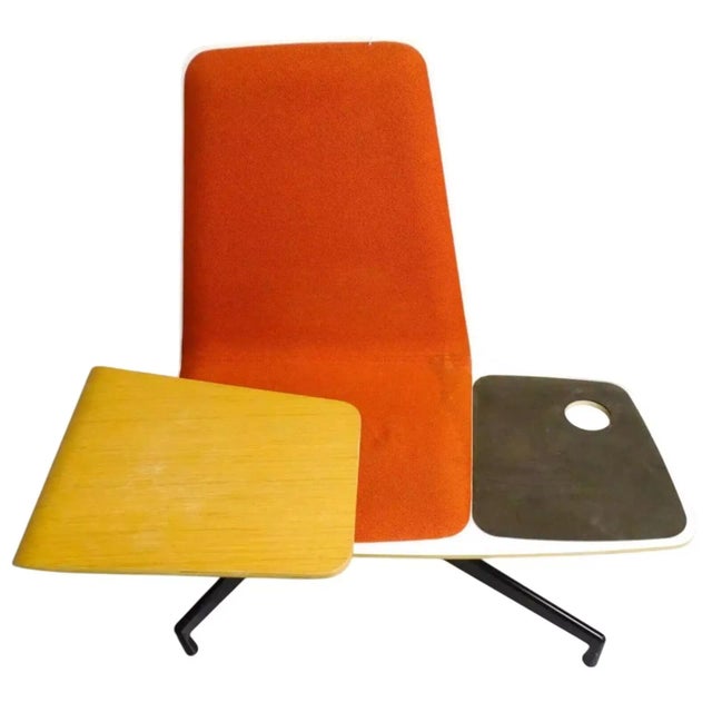 Molded Formica chair features suede leather upholstered lounge seat with beverage holder. Integrated molded Oak wood...