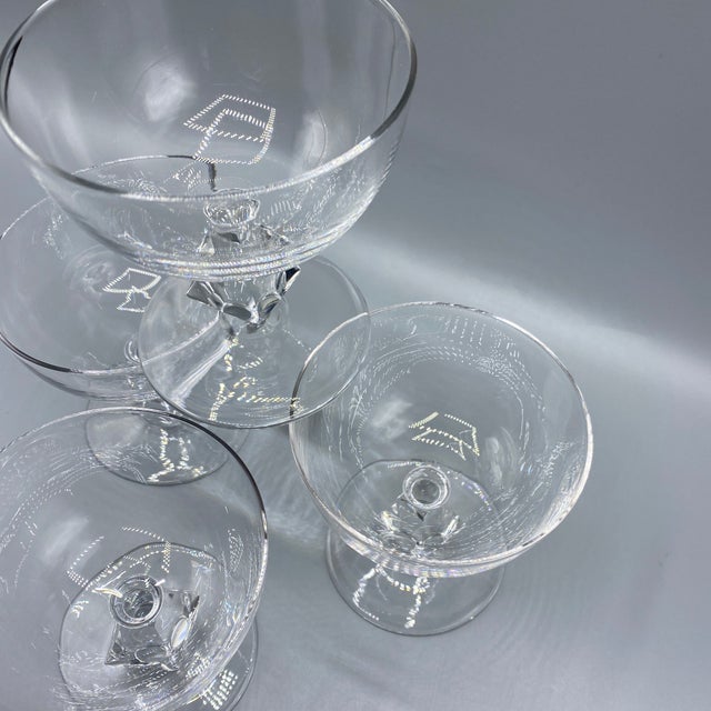 Beautiful set of 4 hand blown champagne coupes glasses by Bryce Aquarius Clear. The stem is very heavy cut crystal.