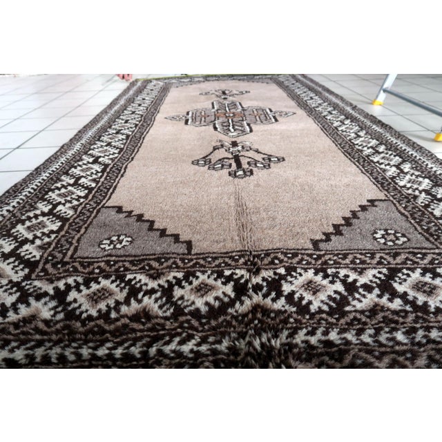 Introducing our captivating Vintage Persian Gabbeh Rug from the 1970s, measuring 3.6’ x 7’ and boasting intricate...