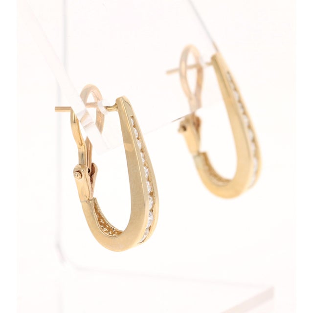 These beautiful hoop channel set earrings have 18 Round Cut Diamonds 0.85 Carats. (Clarity: VS, Color: H) The hoops are...