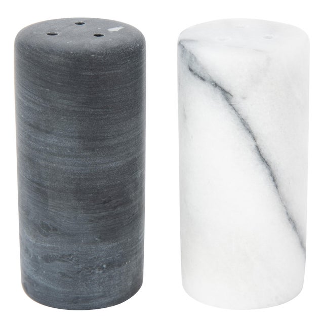 Elevate your dinner table with these Elegant Natural Marble Salt and Pepper Shakers. Each shaker is made of genuine...