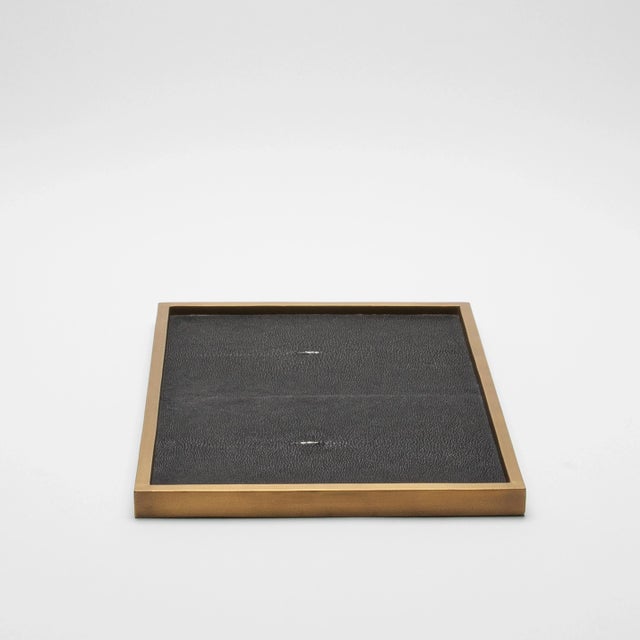 The Rectangular Tray in Black Shagreen with Bronze Patina Brass by Kifu Paris is an epitome of understated elegance,...
