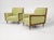 Modern mid-century style lounge chairs. The pair of chairs is newly upholstered and refinished. The chairs are done in a...
