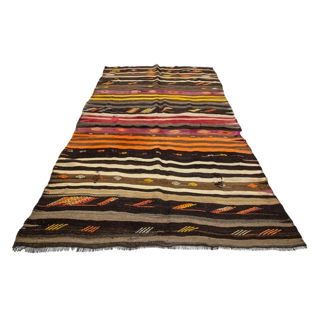 Striped vintage handwoven kilim rug from Afyon region of Turkey. Approximately 50-60 years old. In very good condition