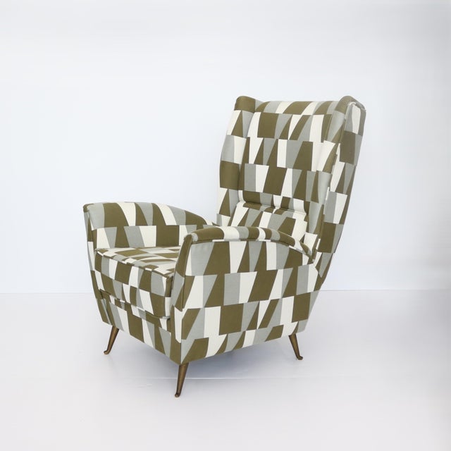 Single Italian Modernist Lounge chair. Generous high back with side wings and a loose seat cushion. Newly upholstered with...