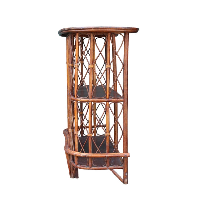 A beautifully sculptural French freestanding bar from the 1970s, made in warm honey-toned rattan, bamboo, hand-woven cane...