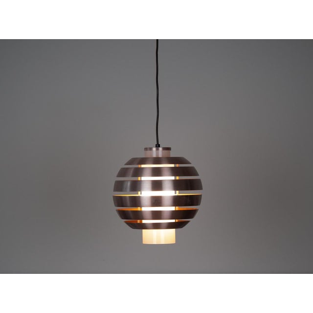 Lyskaer aluminum lamp from the 1970s. The lamp's form was designed based on the principle of a reflective system that...