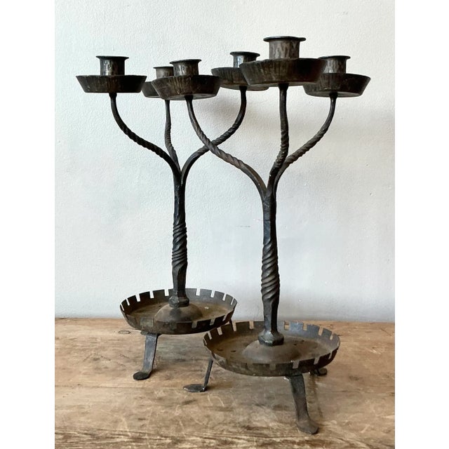 Illuminate your space with the rustic charm of this pair of vintage Boho twisted wrought iron candelabras. Each piece is a...