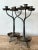 Illuminate your space with the rustic charm of this pair of vintage Boho twisted wrought iron candelabras. Each piece is a...
