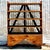 This stylish industrial étagère combines vintage charm with Boho flair. Crafted with open shelving and sturdy wheels, it's...