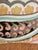 Decorative accent pillow by Design Source International featuring oversized paisley motif in blush, aqua, camel, charcoal,...