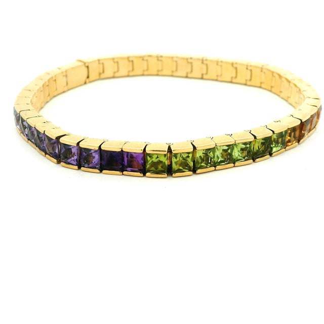 A vibrant vintage bracelet by celebrated Brazilian jeweler H. Stern, crafted in solid 18 karat yellow gold and set with a...
