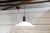 This pendant lamp, in metal and white polycarbonate, is the mod. 1857 and was designed by Elio Martinelli for Martinelli...