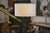 Wrought iron floor lamp in the style of the Marolles workshops, 1950s. Slender, hammered stem with a striking graphic...