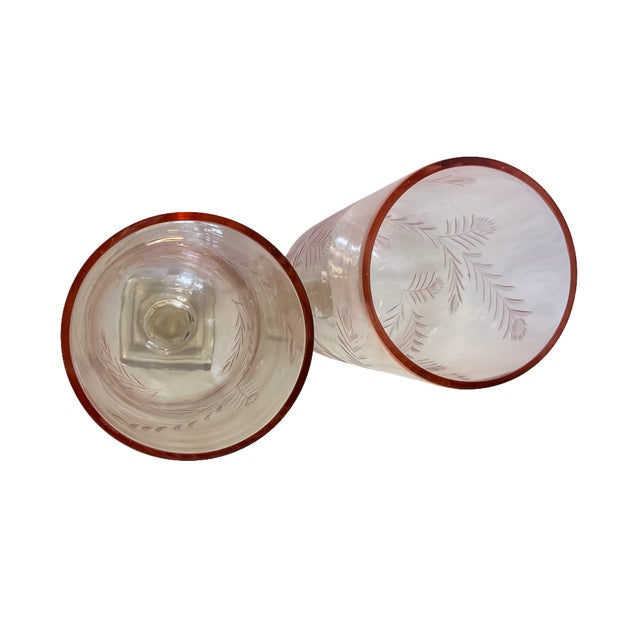 Pair of Hand Blown Rose Colored Cut Glass Hurricanes by A Sanoma with Thistle Design and Clear Square Base. These...