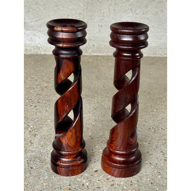Mid-20th Century Pair of Hand-Carved Rosewood Barley Twist Candlesticks Elegant pair of solid rosewood candlesticks...