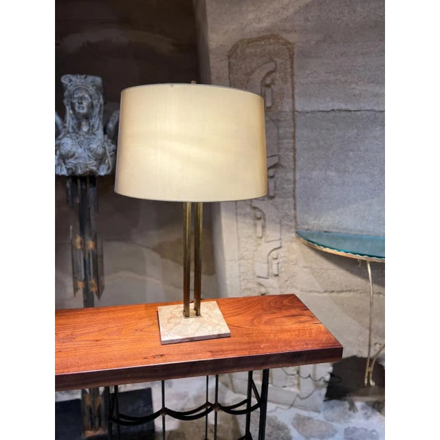 AMBIANIC presents 1950s Elegant Table Lamp designed by Gerald Thurston and produced by Lightolier Lamp is supported by a...