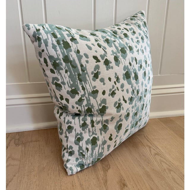 One 20" x 20" outdoor pillow in CW Stockwell's 'Ocelot' in Color 'Seadrift' - a blue and green leopard pattern on white...