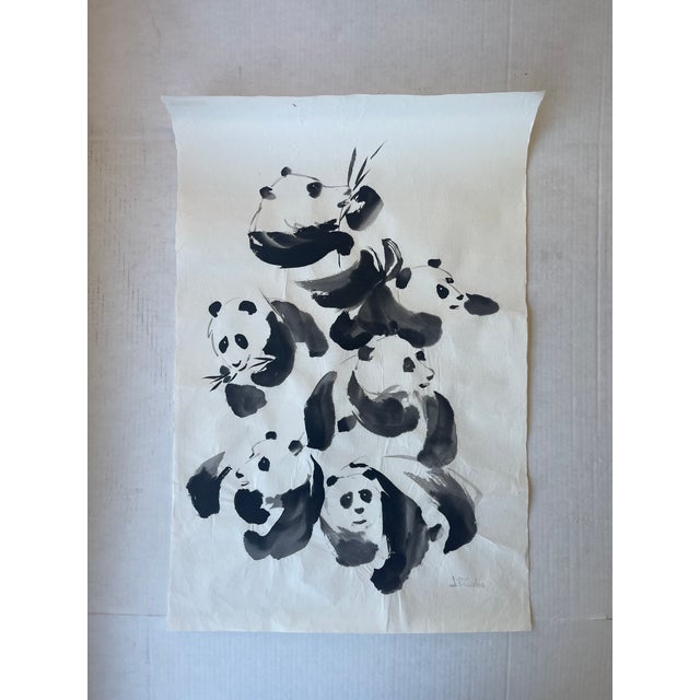 This vintage ink wash painting features a dynamic cluster of pandas depicted in bold, gestural strokes created in the...