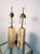 Modern brass and marble lamps by T.H. Robsjohn-Gibbings, 1950's. Each measures 29" high, 4 1/4" by 4 1/4", excellent...