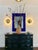 A pair of circular polished brass and matte gold lacquered sconces with radiant backlighting Produced by FLOS , Italy 1982