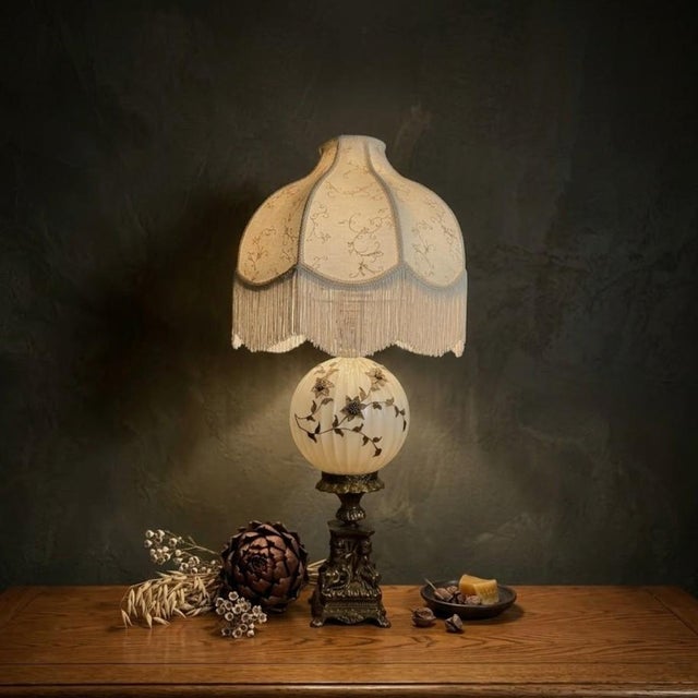 This striking 37-inch Hollywood Regency table lamp features a classically cast brass cherub base by the renowned Accurate...