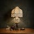 This striking 37-inch Hollywood Regency table lamp features a classically cast brass cherub base by the renowned Accurate...