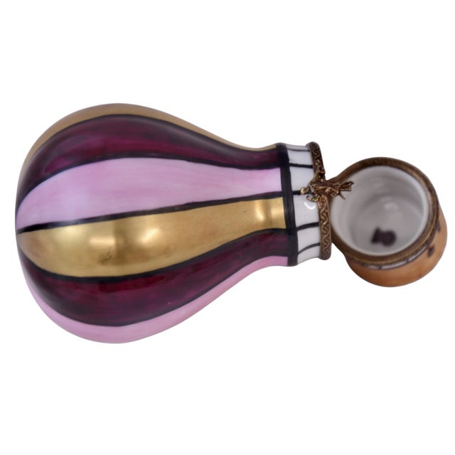 Hand painted Limoges of France trinket box designed as a hot air balloon in burgundy, 24 kt gold, pink, brown and black...